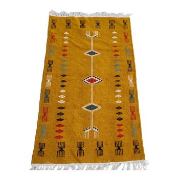 Mustard yellow kilim carpet with multicolored berber patterns
