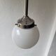 Opaline and chrome-plated metal globe pendant light – 1950s