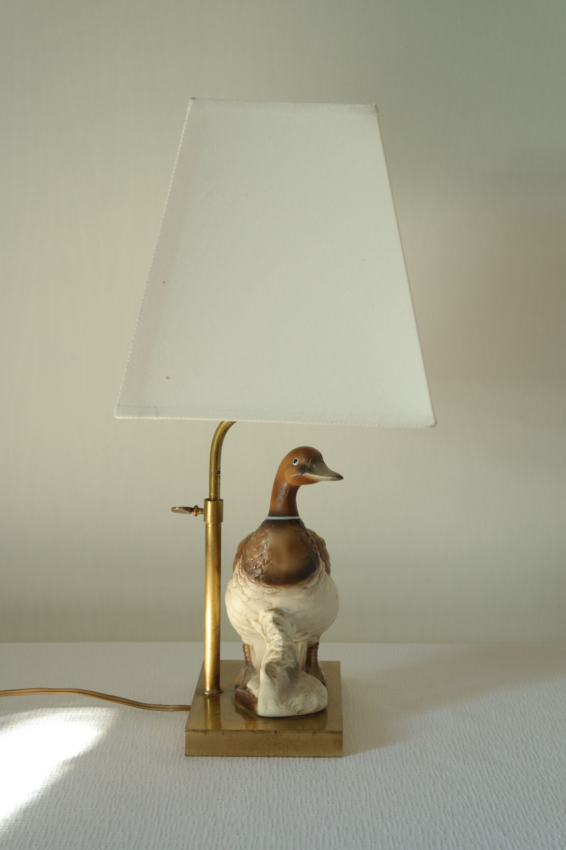 Ceramic duck table lamp and vintage adjustable brass