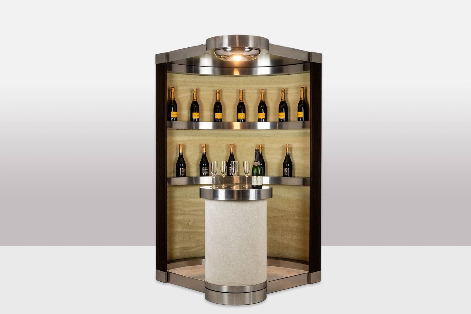 Circular bar in brushed metal, wood and carpet. 1970s.