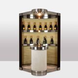 Circular bar in brushed metal, wood and carpet. 1970s.