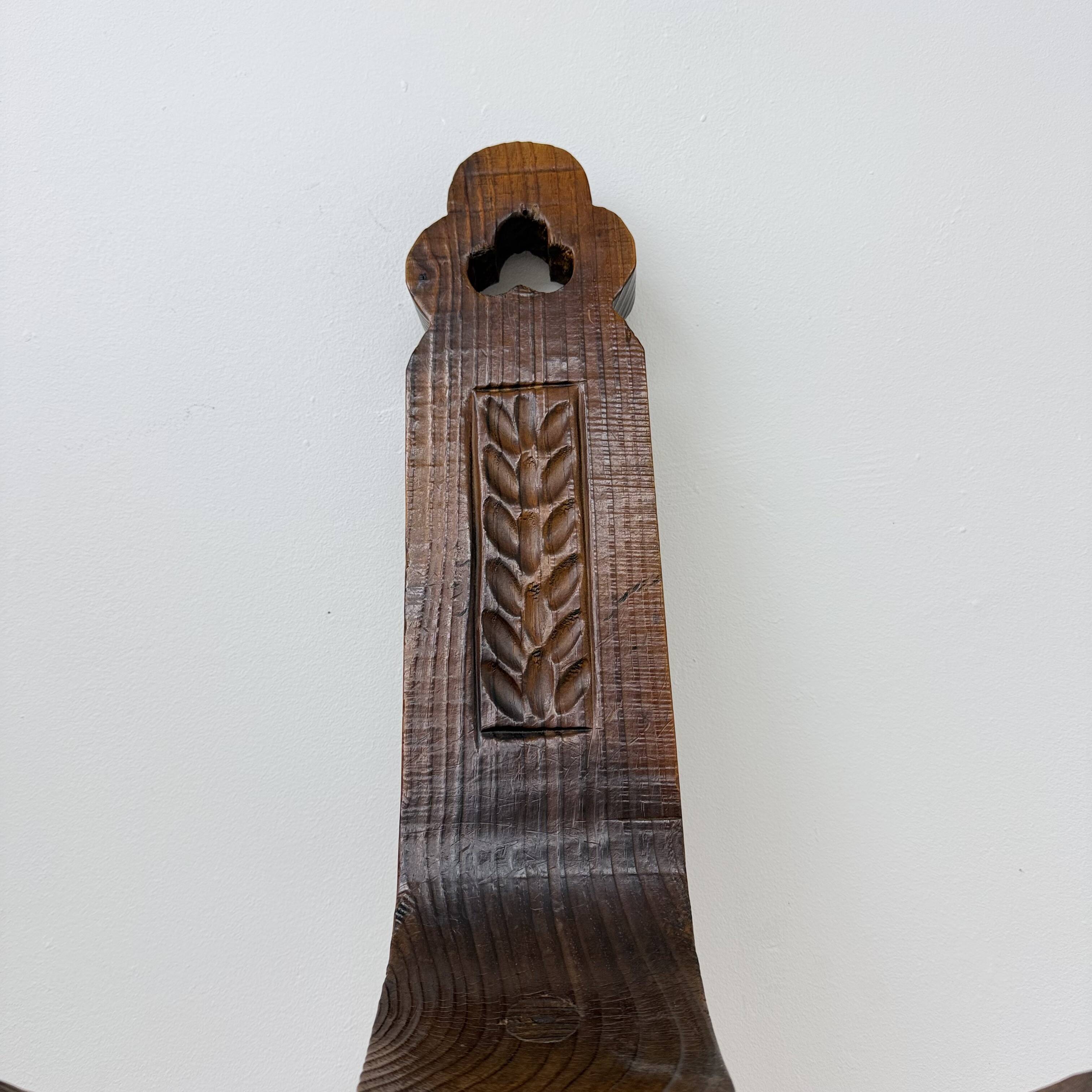 Brutalist hand carved oak Spanish tripod chair , 1970s