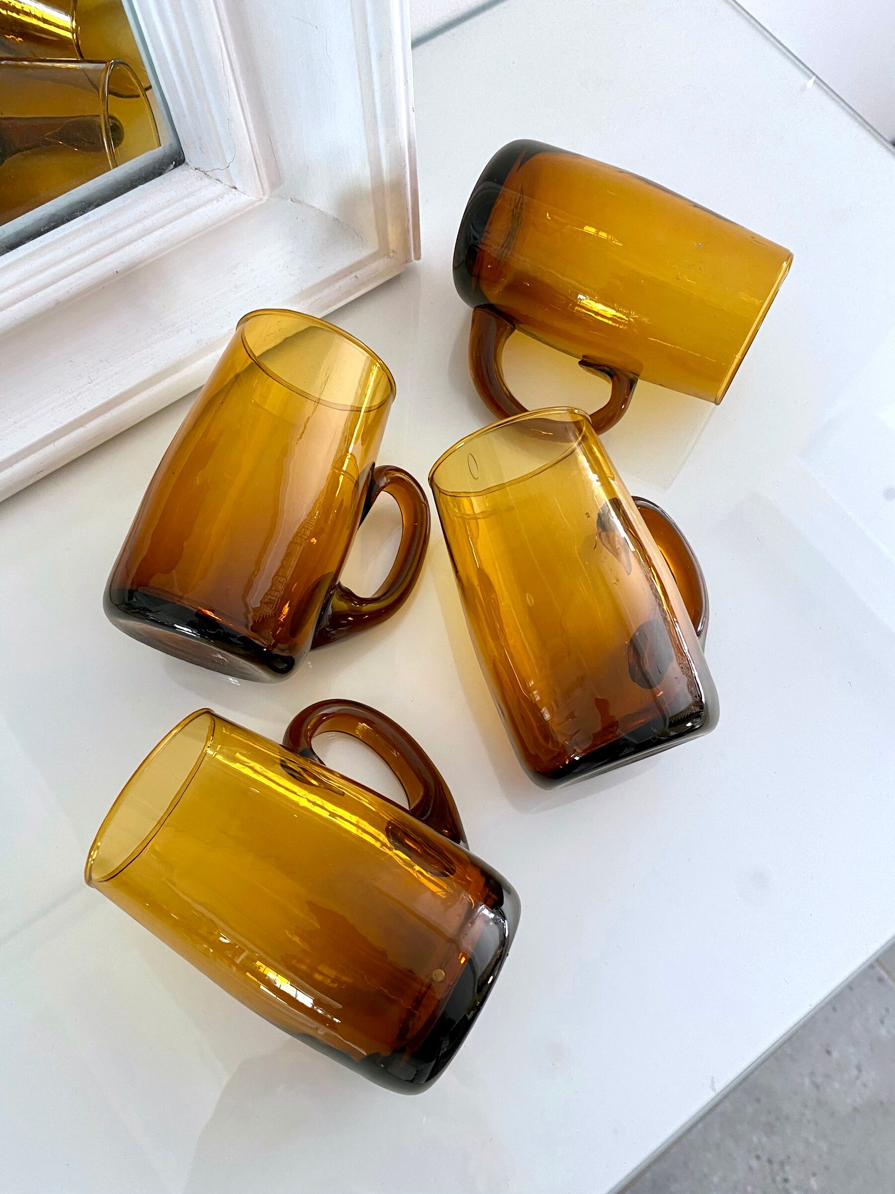 4 mugs/ mugs in vintage blown amber glass