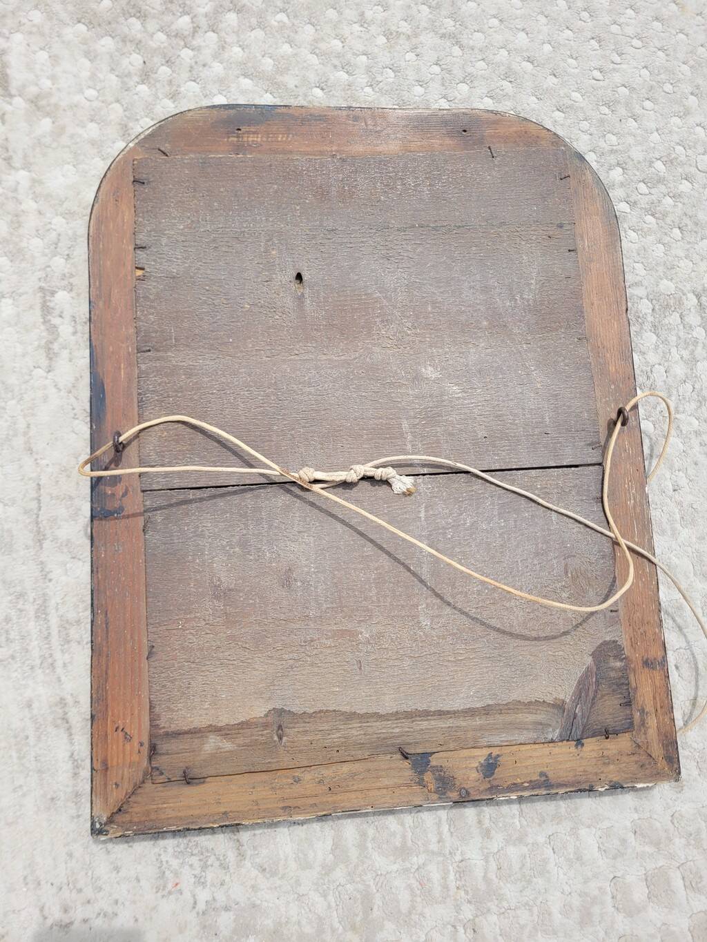 Antique mirror in Napoléon III style, blackened with beaded frieze, 42x55cm.