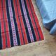 Traditional rustic red wool rug with stylized design and stripes, authentic hand-woven 160x230cm