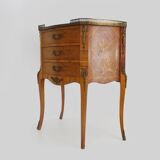 Baroque style wooden chest of drawers with bronze frieze.