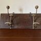 Patinated wood and metal coat rack from the 1950s.
