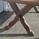Table à manger moitié de siècle piètement croisé