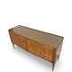 Veneered burl walnut chest of drawers with light warm brown glass top