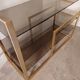 Brass shelf, smoked glass