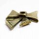Brass bow tie candle holder 1970