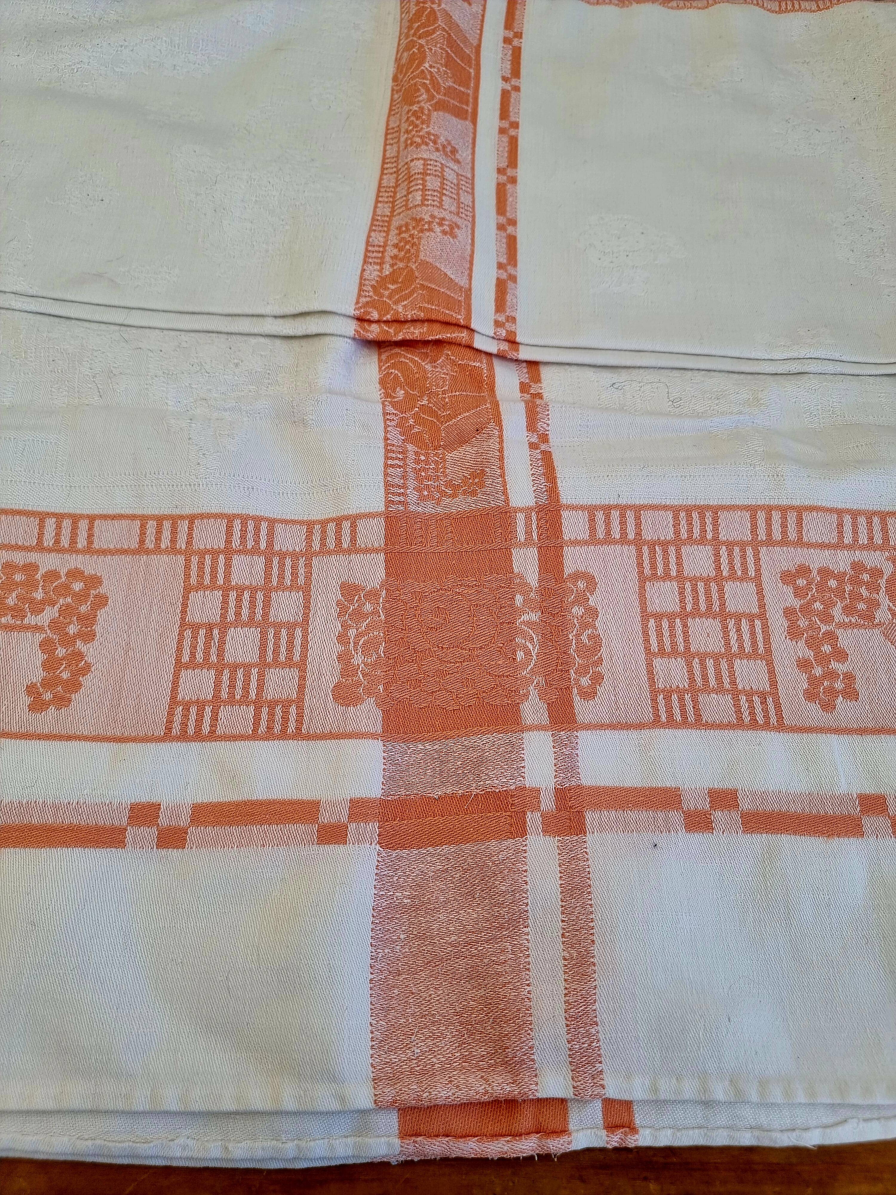 Antique orange and white damask tablecloth