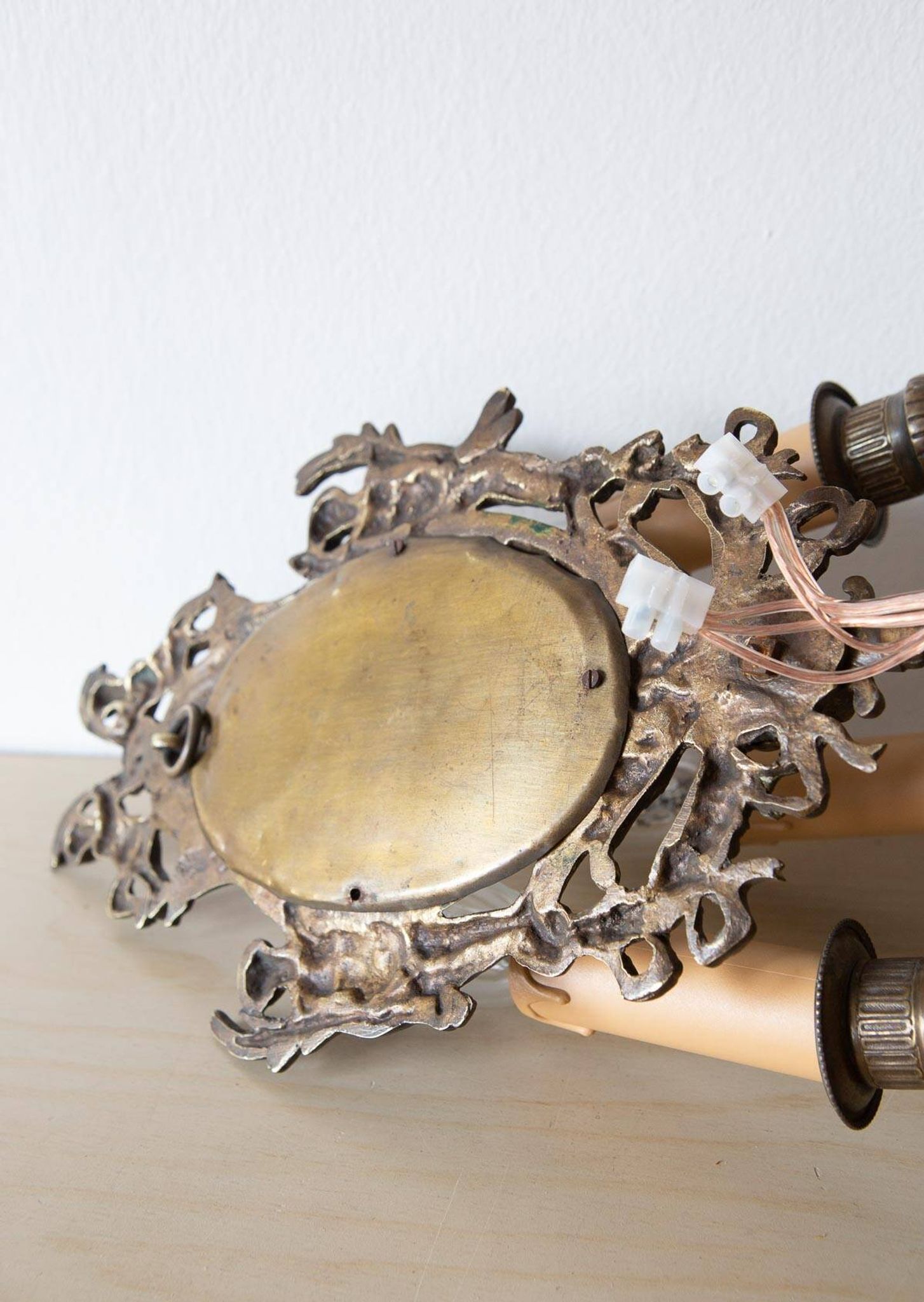 Pair of old French wall lights with beveled mirror and putti