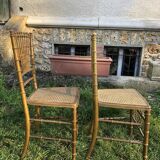 Pair of caned chairs in gilded wood