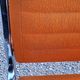 Pair of designer armchairs in orange fabrics and chrome tubes from the 70s
