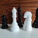 5 black and white ceramic chess pieces