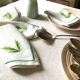 Series of four embroidered linen napkins