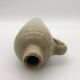 Old hot water bottle in glazed stoneware, beige color