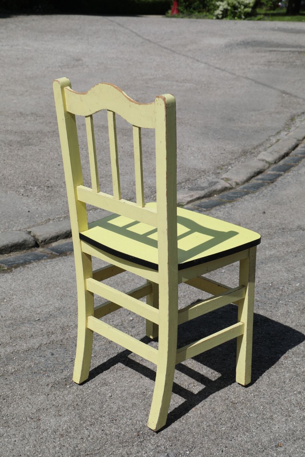 Formica and yellow wood chair