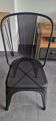 Genuine Tolix chair, black perforated sheet metal, in new condition.