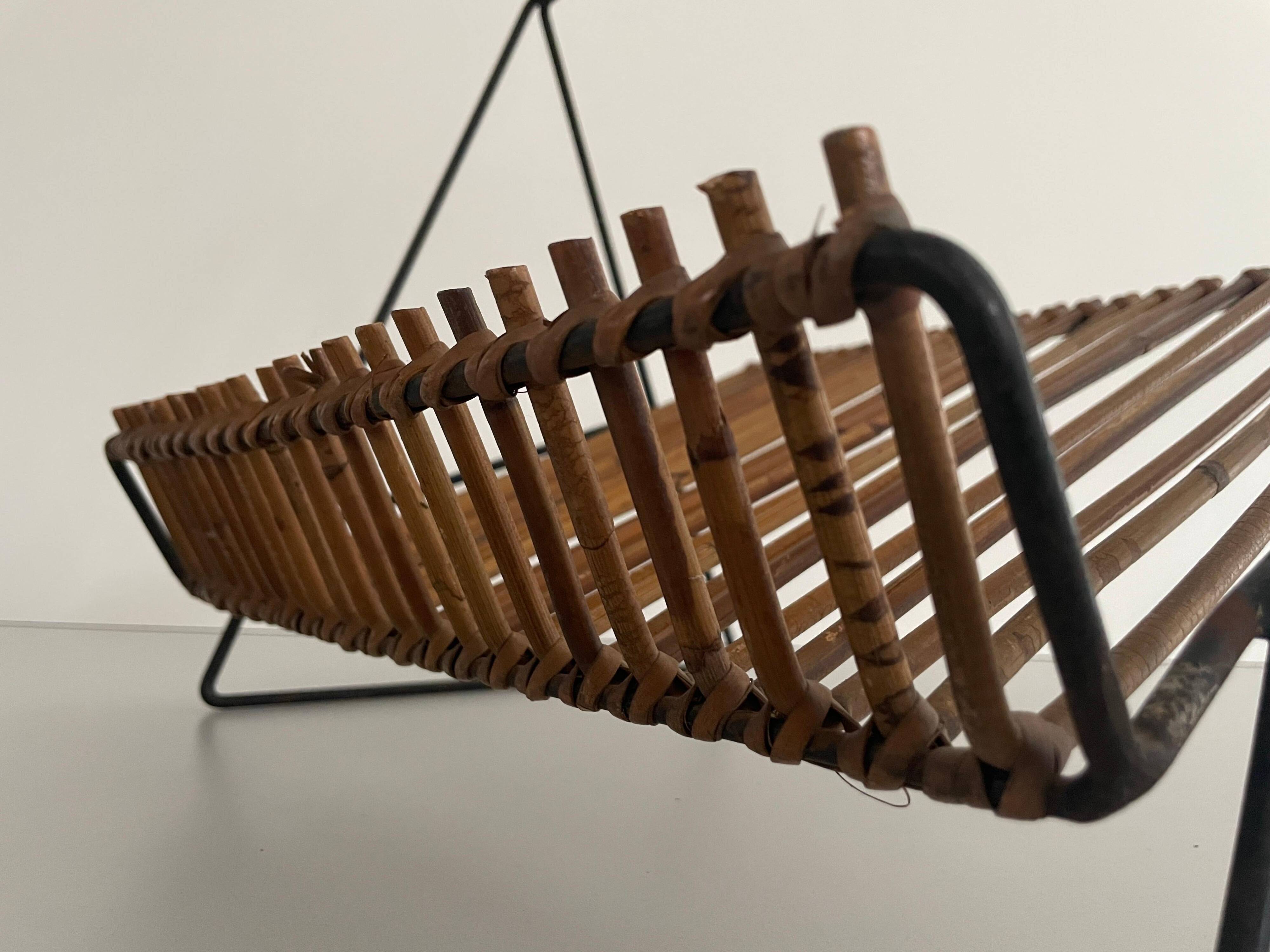 Mid-century black metal and rattan magazine rack, 1960, Italy