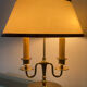Directoire style bouillotte lamp in brass with double lights.