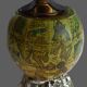 Vintage antique lighter with a globe and silver-plated stand.