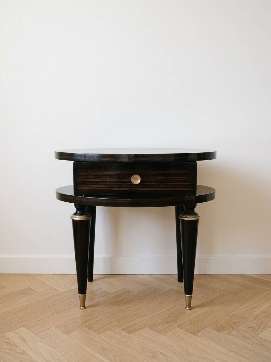 Art Deco bedside table in black wood with gold details.