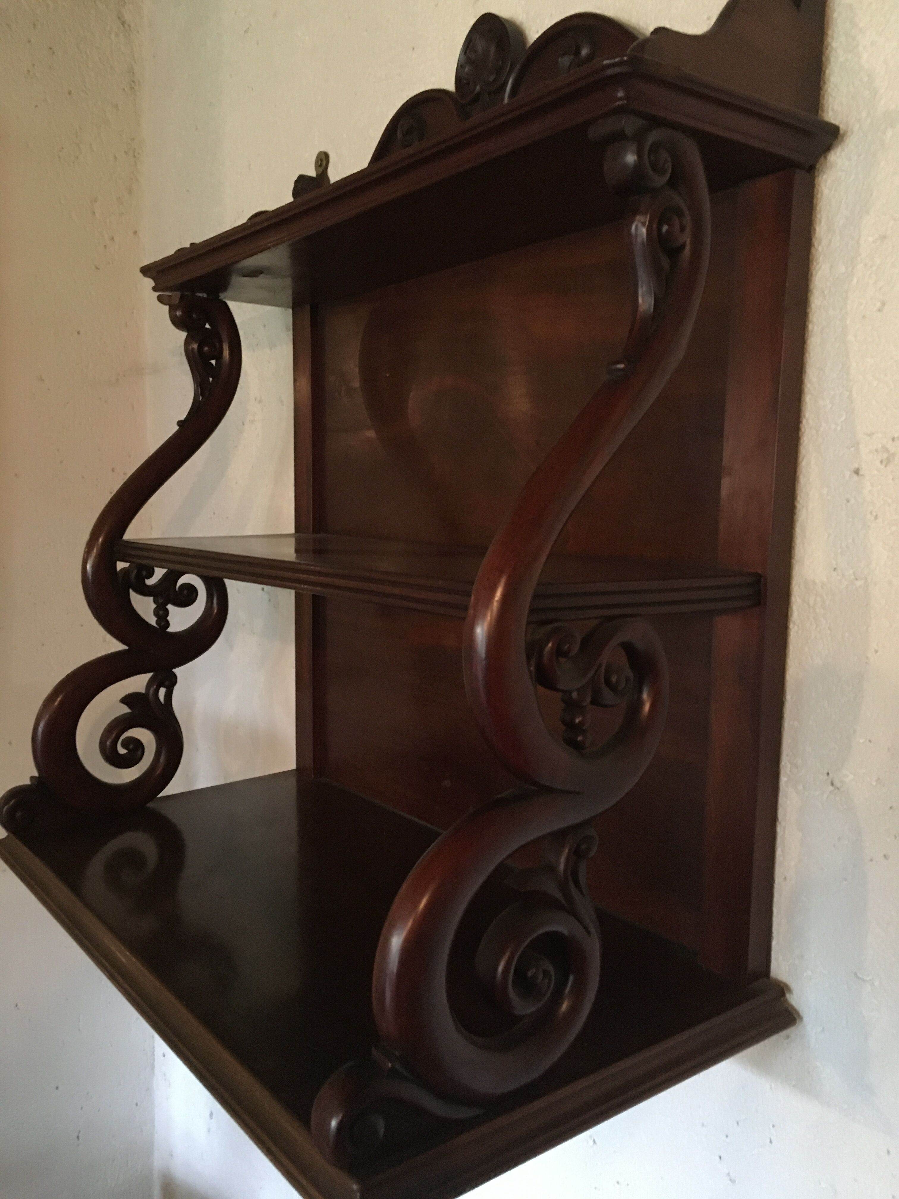 Carved wooden wall shelf.
