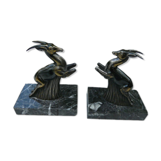 Pair of greenhouse book antelope in regulation on marble base
