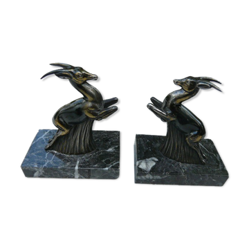 Pair of greenhouse book antelope in regulation on marble base