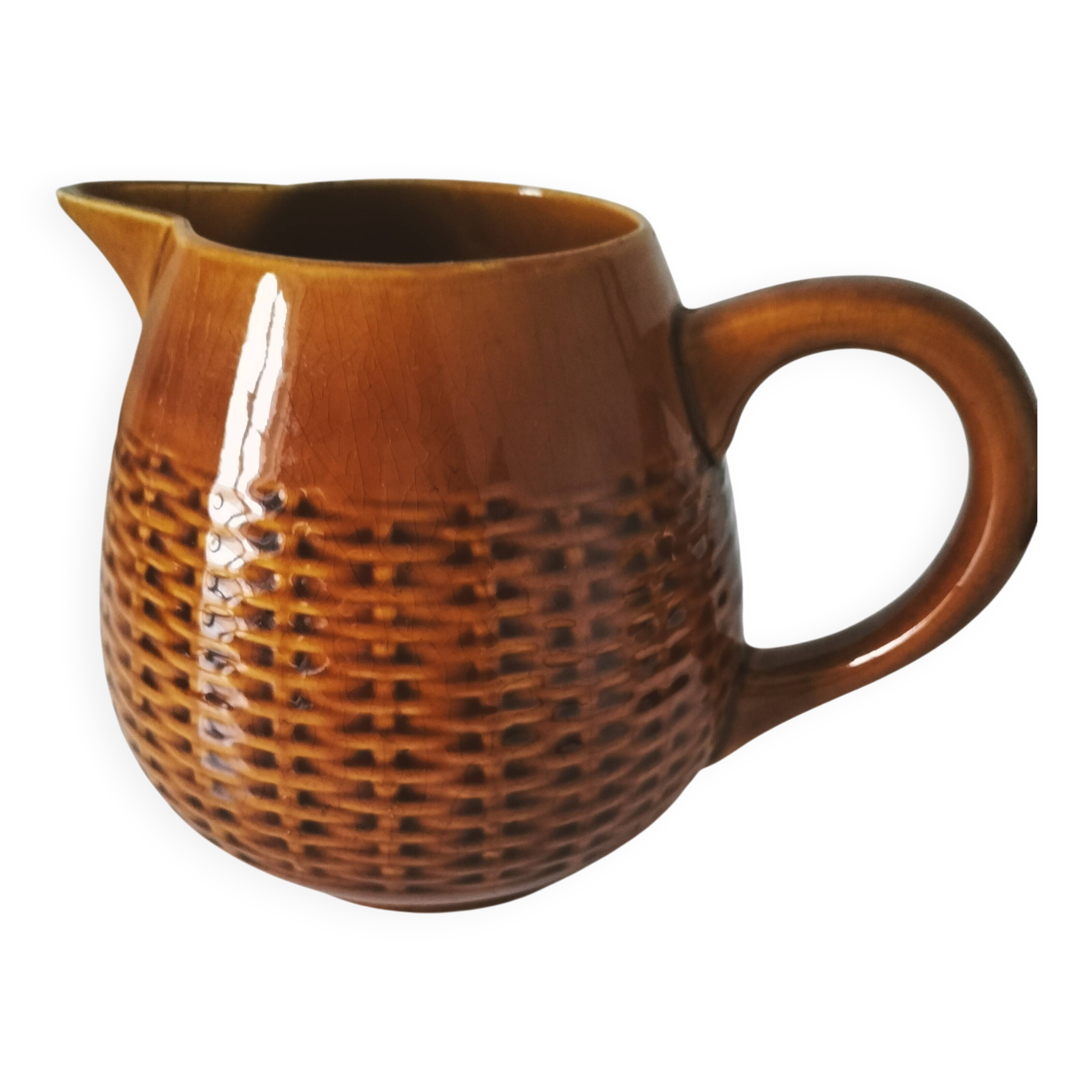 Caramel slipware pitcher with braided relief