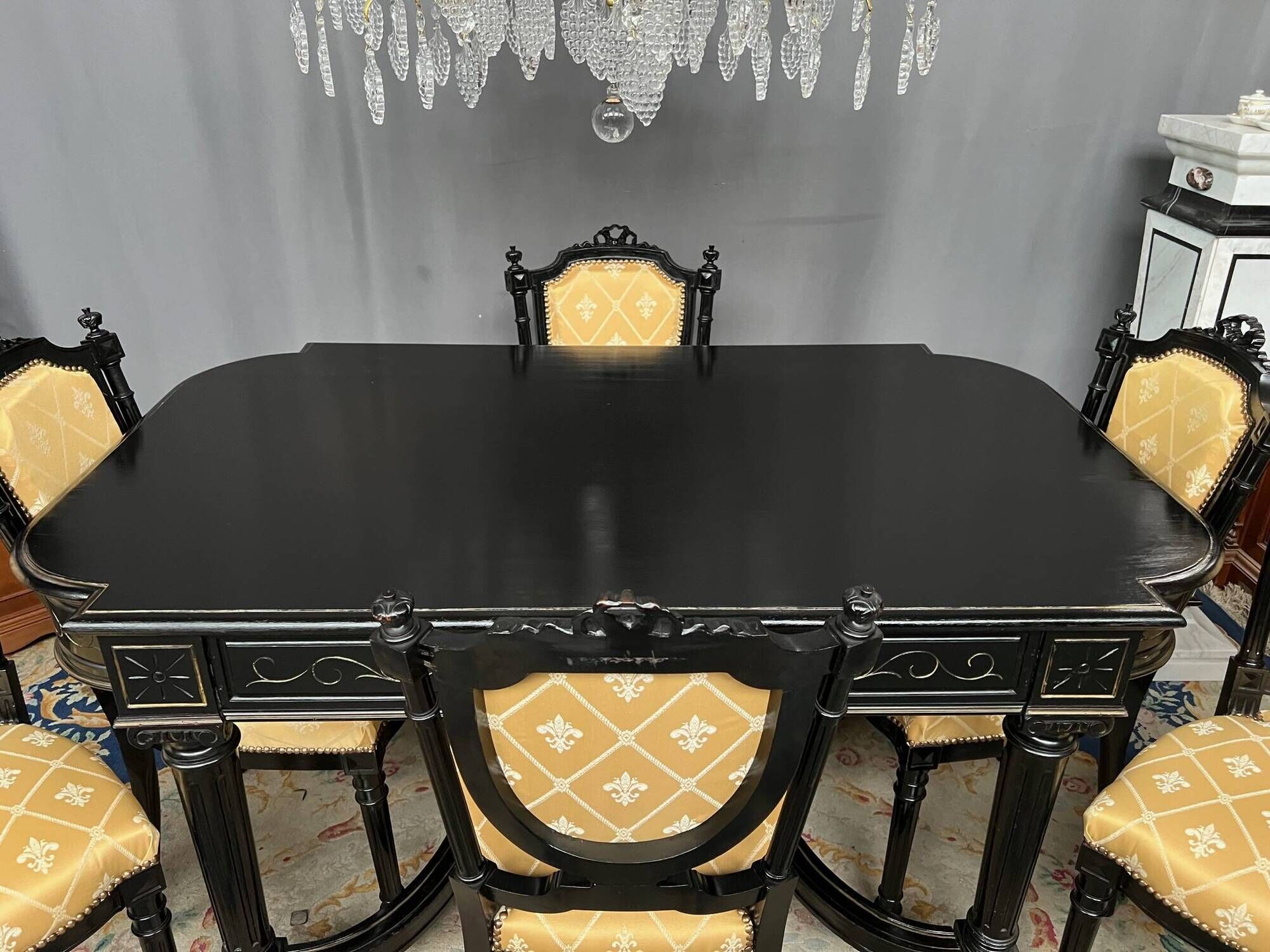 Dining room set consisting of a table and six chairs from the Napoleon III period.