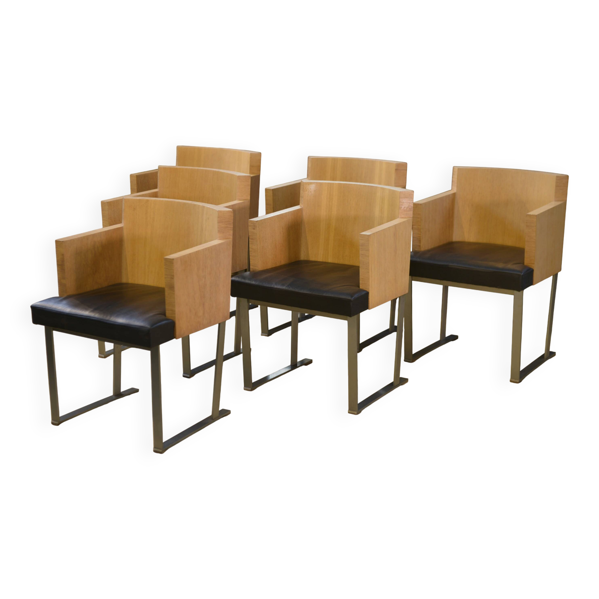 Set of 6 designer armchairs in oak and leather from the 1980s.