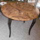 Round table art deco style - elm magnifying glass top and black wooden legs