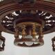 French vintage Breton chandelier with hand-carved figures, well, and lantern lights.