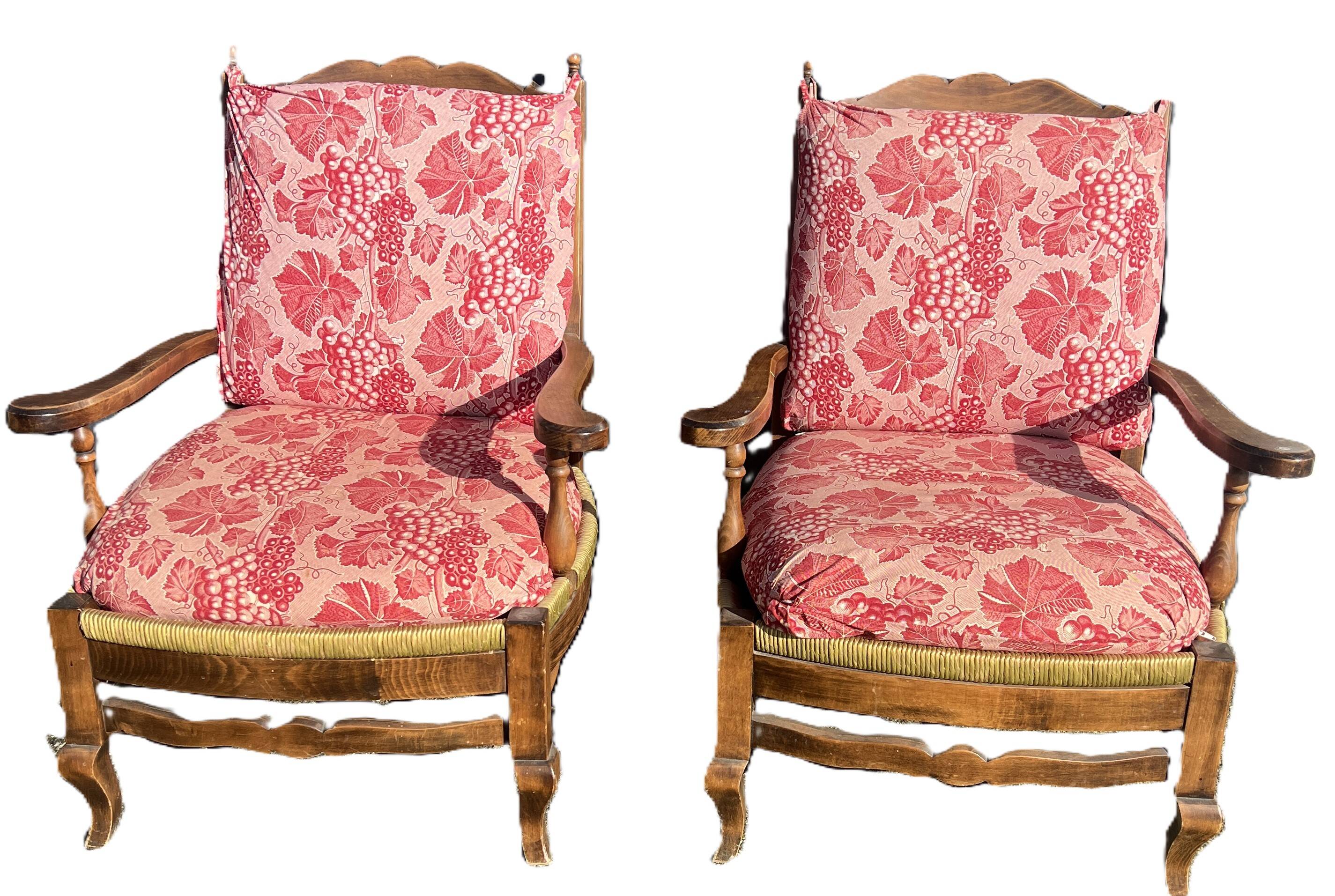 pair of rustic wood and fabric armchairs