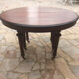Oval table with extensions in massive mahogany napoleon III era.