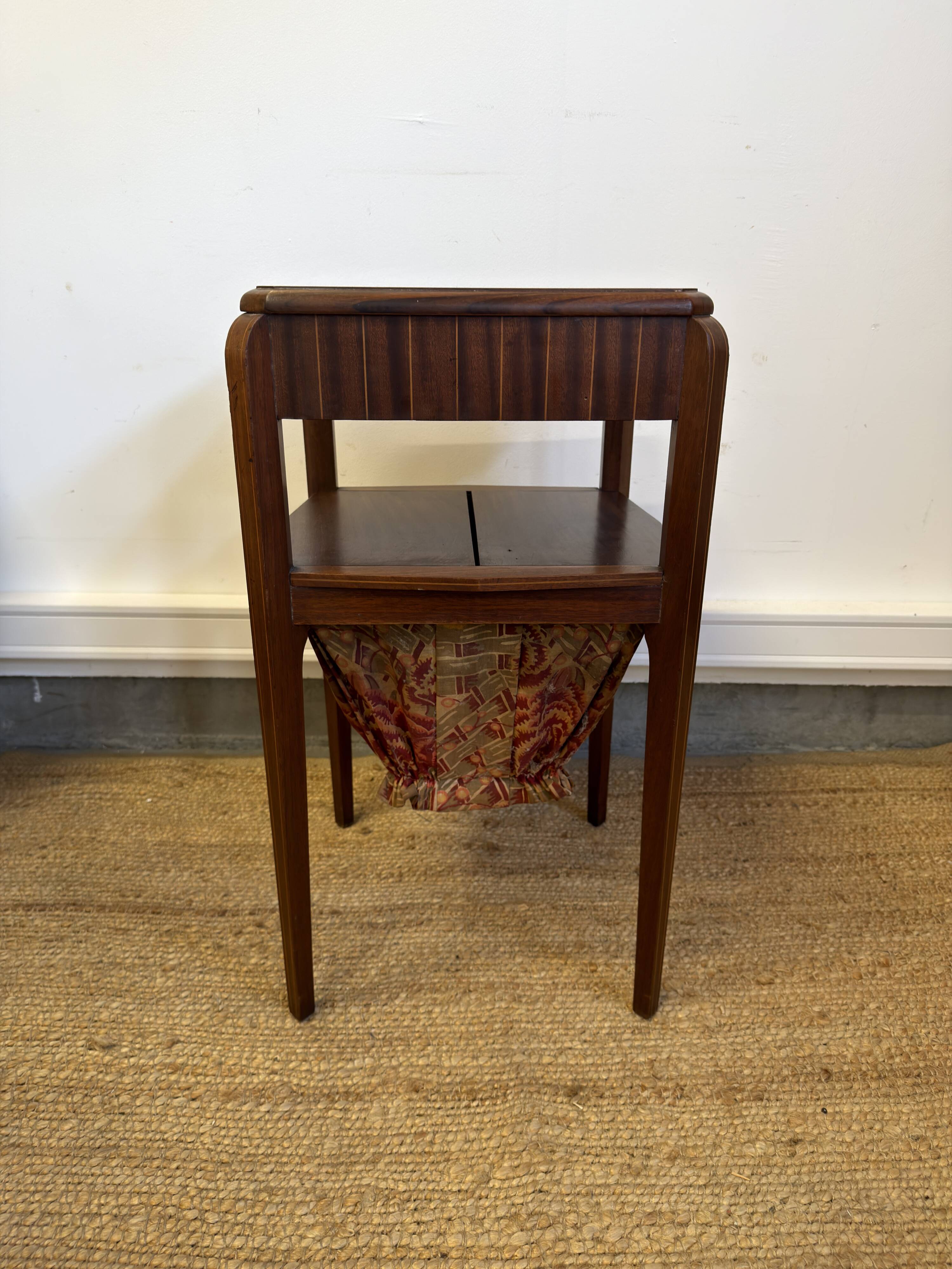 Art Deco sewing table in walnut with a foldable shelf.