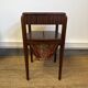 Art Deco sewing table in walnut with a foldable shelf.