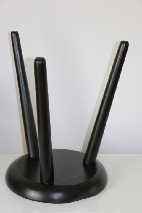 Black tripod wooden stool
