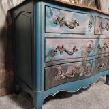 Patinated crossbow chest of drawers