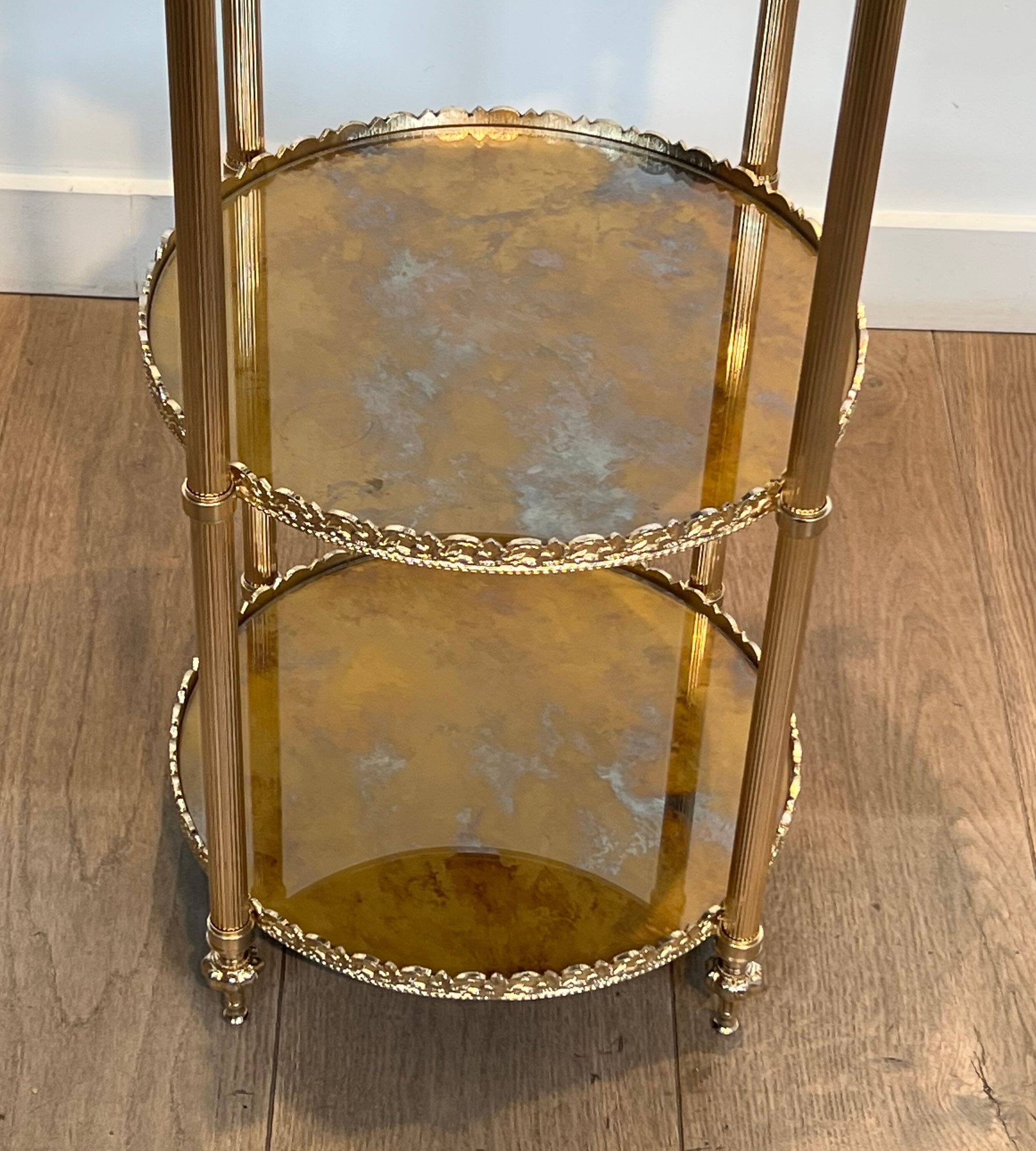 Round silver-plated brass table with triple eglomisé mirror tops from Maison Jansen.