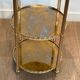 Round silver-plated brass table with triple eglomisé mirror tops from Maison Jansen.