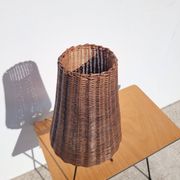 Tripod lamp and rattan from the 1950s.