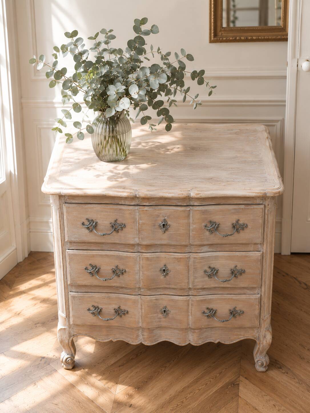 Beautifully crafted Louis XVI style commode in bleached wood.