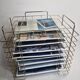 Vintage "wire" magazine rack in gold metal