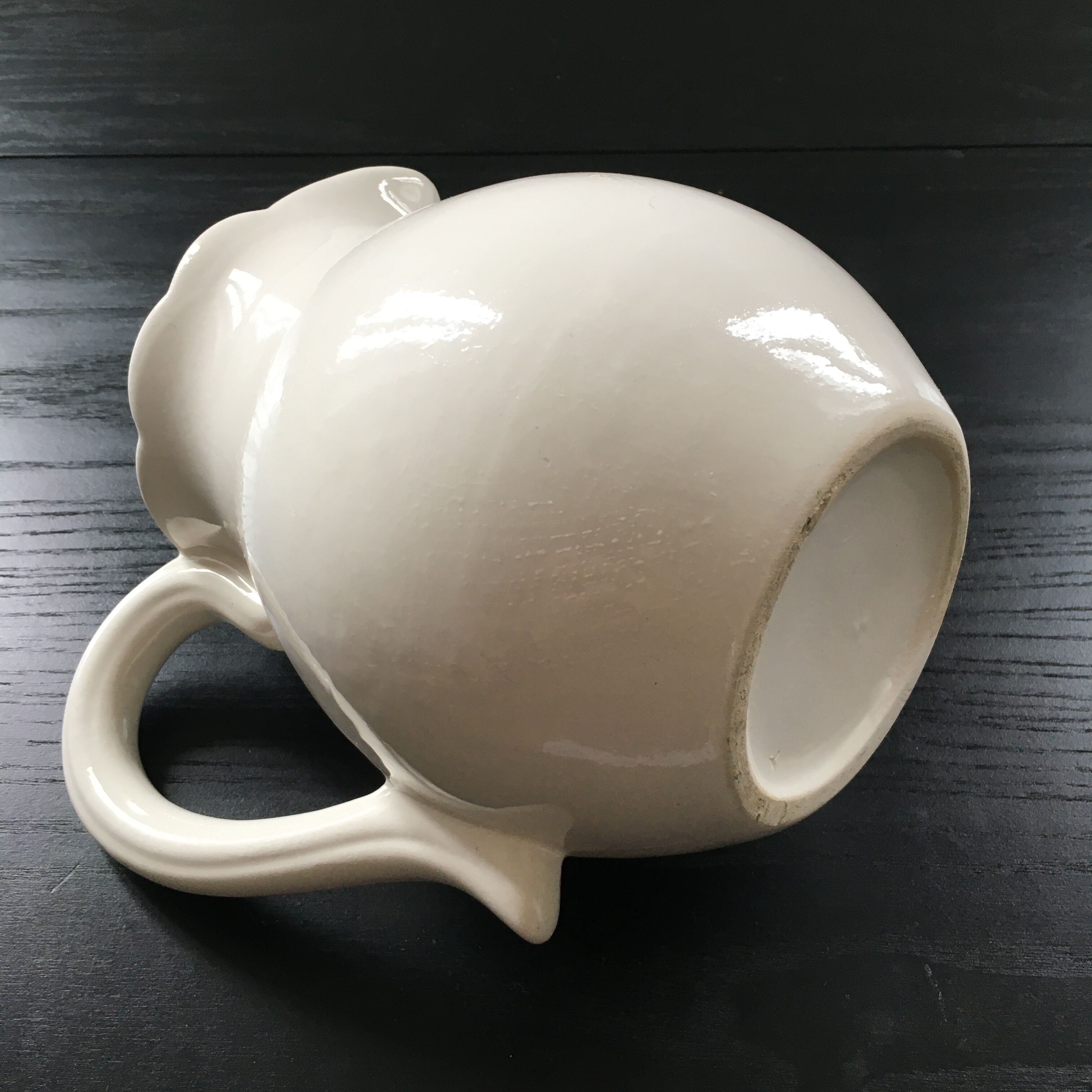 Fruit-decorated pitcher in slipware