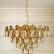 Vintage chandelier in gilded brass with crystal pendants.