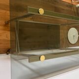 Vintage brass and smoked glass dessert trolley on wheels.